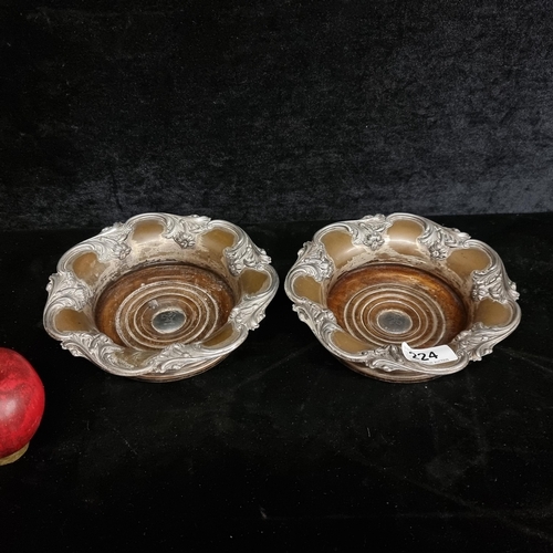 224 - Star Lot : A stunning pair of Victorian bottle coasters with a sterling silver cartouche to centre b... 