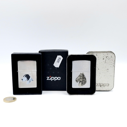 26 - Two Zippo lighters - one with a horse head front's piece together with a dog example. Boxed.