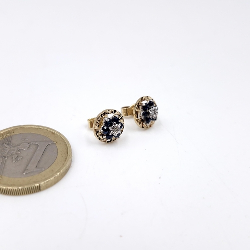 34 - A pair of nine carat gold sapphire & diamond stud earrings. Weight - 1.99 grams.