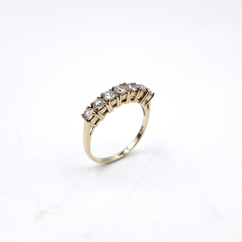 37 - Super Star Lot : A nice example of a nine carat gold seven stone diamond half eternity ring. Est. we... 