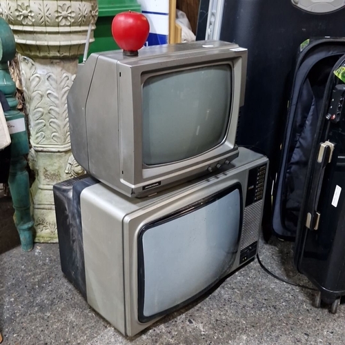 681 - Two vintage televisions, metal and plastic, circa 1970s. The smaller unit features a woodgrain finis... 