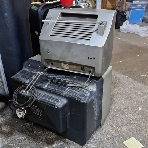 681 - Two vintage televisions, metal and plastic, circa 1970s. The smaller unit features a woodgrain finis... 