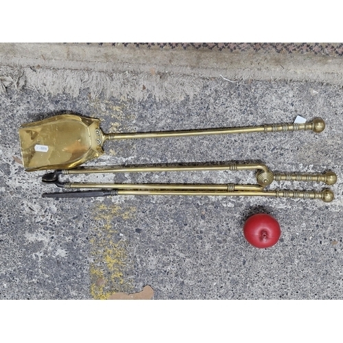 1230 - A super antique heavy brass 3 piece fire set including a shovel, tongs and poker.
Previous in auctio... 