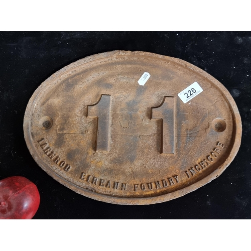 1262 - An original vintage very heavy cast iron plaque, oval-shaped with number 