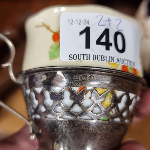 140 - Two Royal Albert Crown China cup and saucer sets paired with sterling silver cup holders, hallmarked... 