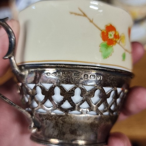 140 - Two Royal Albert Crown China cup and saucer sets paired with sterling silver cup holders, hallmarked... 