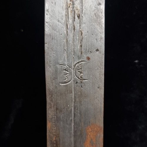 103 - Star Lot : A mid 20th century African turareg sword and scabbard. Selling online for €250+. (damage ... 