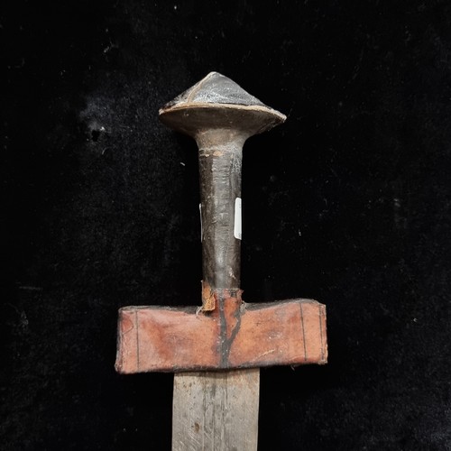 103 - Star Lot : A mid 20th century African turareg sword and scabbard. Selling online for €250+. (damage ... 