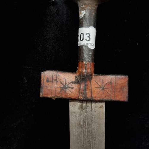 103 - Star Lot : A mid 20th century African turareg sword and scabbard. Selling online for €250+. (damage ... 