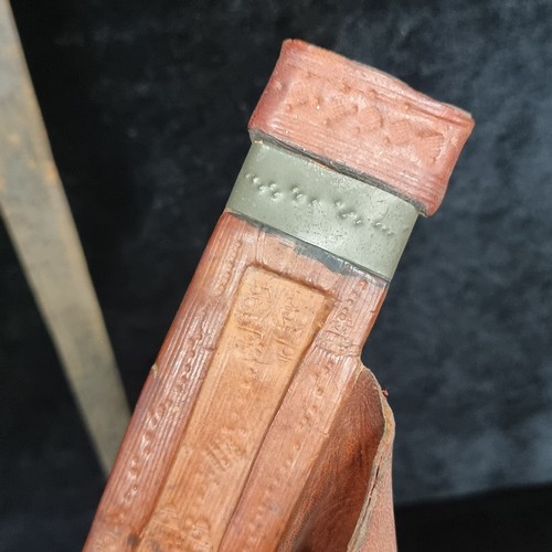 103 - Star Lot : A mid 20th century African turareg sword and scabbard. Selling online for €250+. (damage ... 