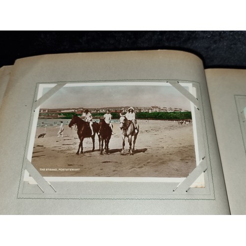 94 - A fabulous antique fully furnished post card album containing antique Irish post cards.