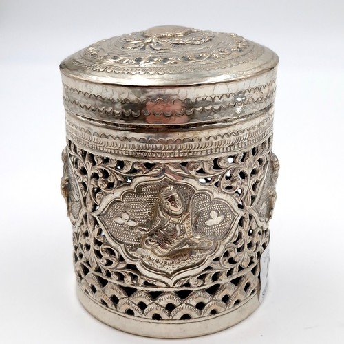 8 - A most attractive profusely decorated Indian silver canister with lid. Dimensions: 7 cms diameter. H... 