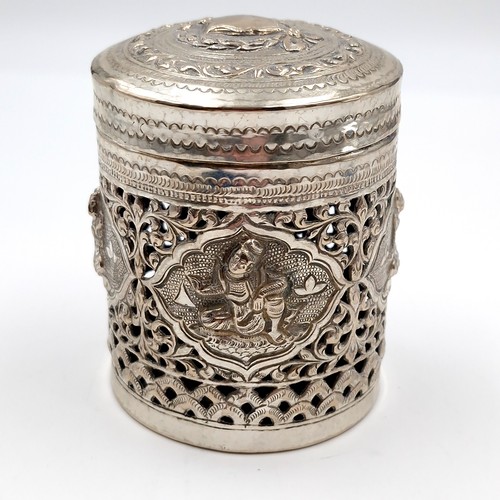 8 - A most attractive profusely decorated Indian silver canister with lid. Dimensions: 7 cms diameter. H... 