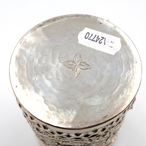 8 - A most attractive profusely decorated Indian silver canister with lid. Dimensions: 7 cms diameter. H... 