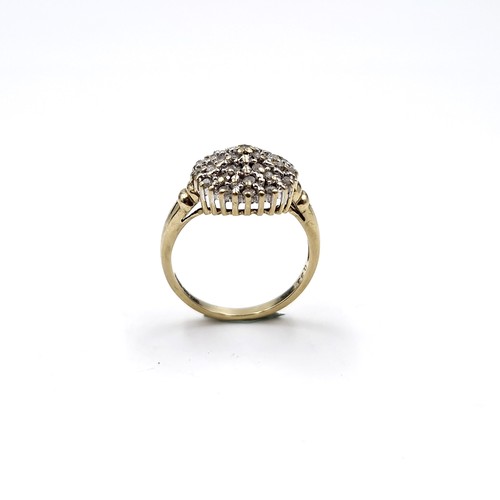 30 - Star Lot : A pretty nine carat gold diamond cluster ring. Size - N. Weight - 3.37 grams.