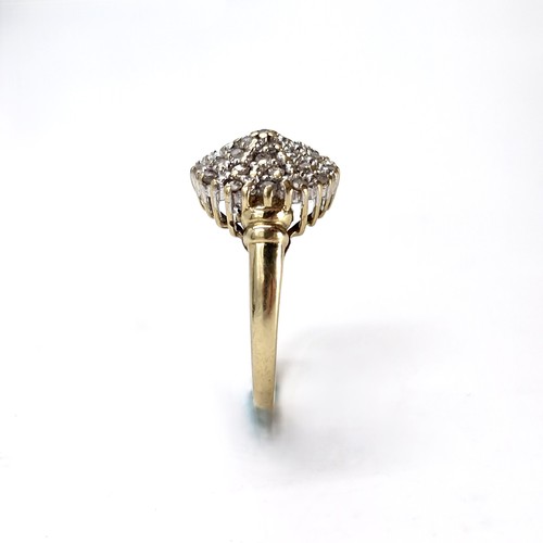 30 - Star Lot : A pretty nine carat gold diamond cluster ring. Size - N. Weight - 3.37 grams.