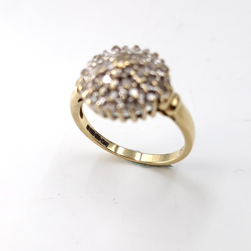 30 - Star Lot : A pretty nine carat gold diamond cluster ring. Size - N. Weight - 3.37 grams.