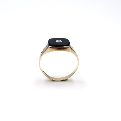 33 - Star lot : A nine carat gold gents onyx and diamond signet ring. Size - S. Weight - 2.54 grams.