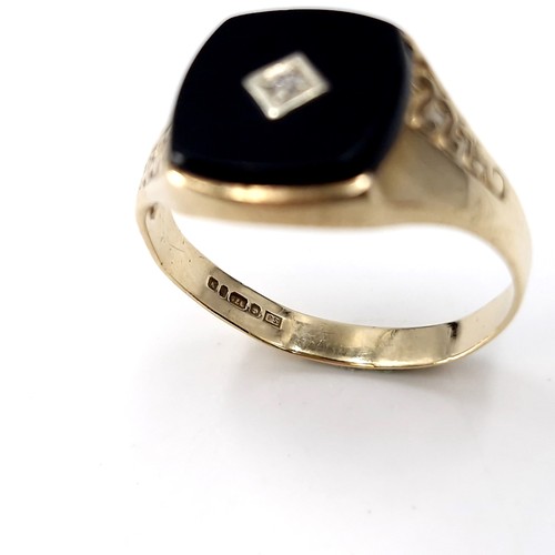 33 - Star lot : A nine carat gold gents onyx and diamond signet ring. Size - S. Weight - 2.54 grams.