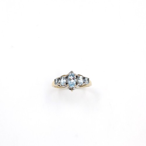 36 - Star Lot : A nine carat gold blue topaz cluster set ring. Size - M 1/2. Weight - 2.6 grams.