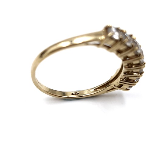 37 - Super Star Lot : A nice example of a nine carat gold seven stone diamond half eternity ring. Est. we... 