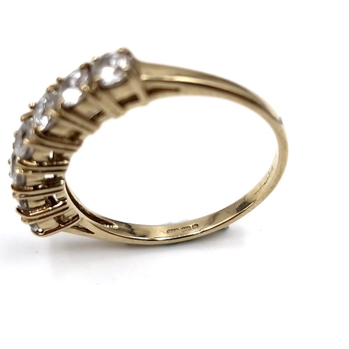 37 - Super Star Lot : A nice example of a nine carat gold seven stone diamond half eternity ring. Est. we... 