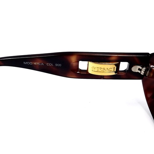 43 - A pair of  designer Versace sunglasses 'Made in Italy'.  Comes in original leather pouch. Similar ne... 