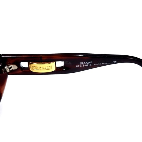 43 - A pair of  designer Versace sunglasses 'Made in Italy'.  Comes in original leather pouch. Similar ne... 