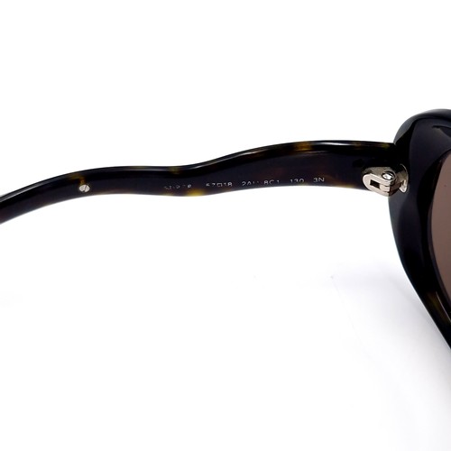 45 - A pair of designer Prada 'Made in Italy' sunglasses. Comes in original box. Similar new €360