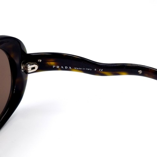 45 - A pair of designer Prada 'Made in Italy' sunglasses. Comes in original box. Similar new €360