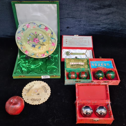 123 - Five boxes of vintage Chinese items including three sets of meditation Baoding balls, a jade Gua sha... 