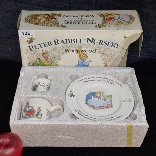 126 - A charming Wedgwood Peter Rabbit Nursery set including plate, Porringer, mug and egg cup. In origina... 