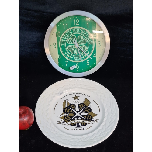 128 - Two pieces of Celtic football memorabilia including a wall clock and  handpainted porcelain plate.