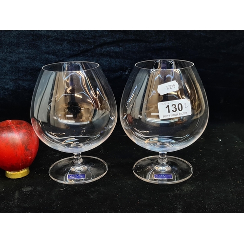 130 - A pair of Marquis Waterford Crystal Brandy balloon glasses. In good condition with acid marks to bas... 