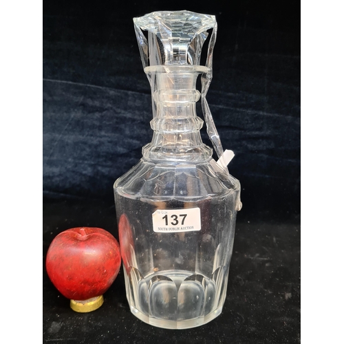 137 - A Georgian early 1800 three ring cut glass decanter with stopper. Small crack to inside of glass but... 