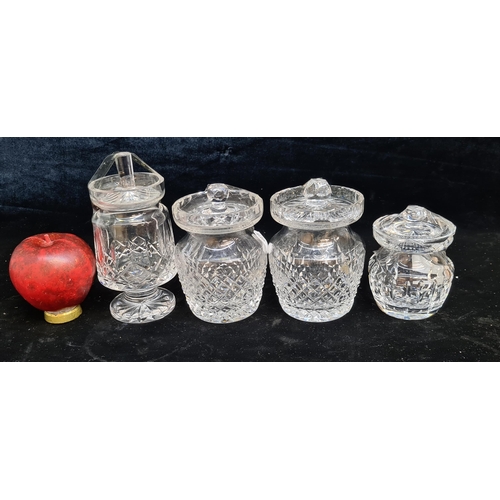 139 - Four Waterford Crystal lidded preserve pots. In good condition with acid marks to base.