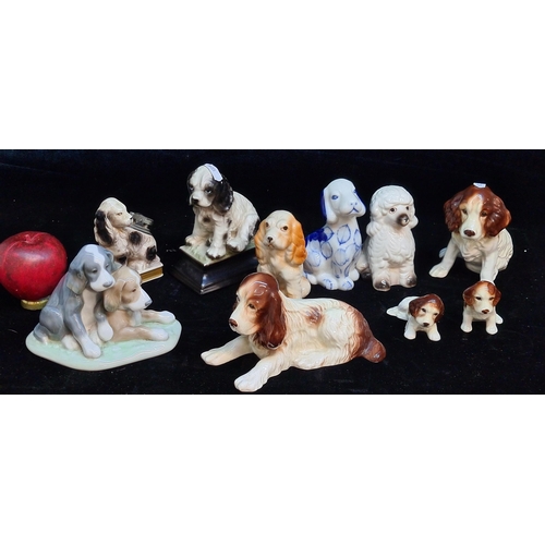 150 - A collection of ten gorgeous porcelain and ceramic dogs including Sylvac and Nao examples.