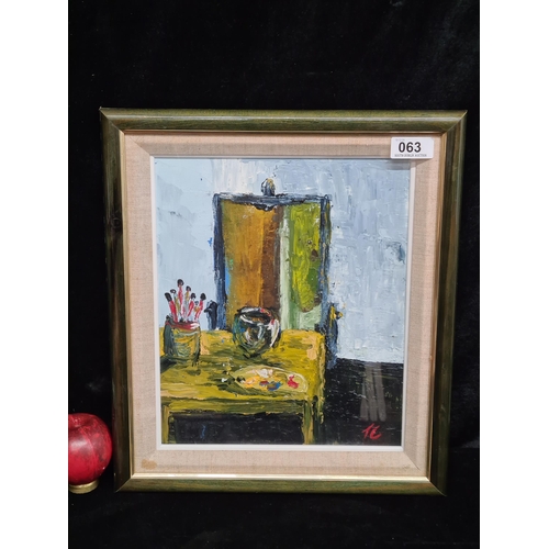 63 - A brilliant original oil on board painting. Features a still life study of an artist's table with br... 