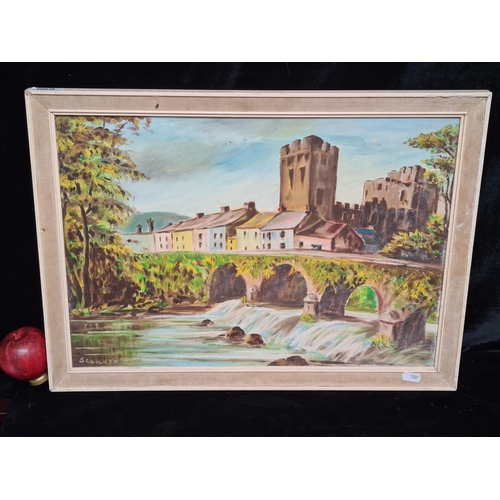 69 - A delightful original oil on board painting. Features a quaint town landscape with a bridge. Rendere... 