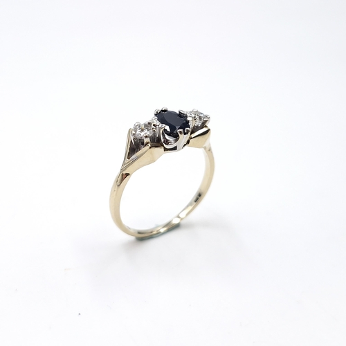 10 - Star lot : A sapphire and diamond ring set in nine carat gold. Size - K 1/2. Weight - 2.1 grams.