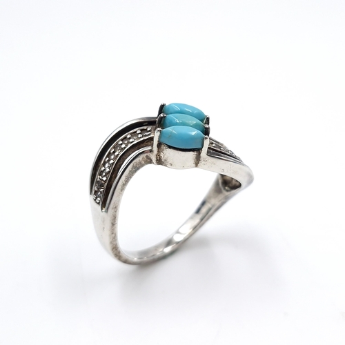 14 - A Native American style sterling silver twist turquoise and gem set ring. Size - R. Weight - 4.9 gra... 