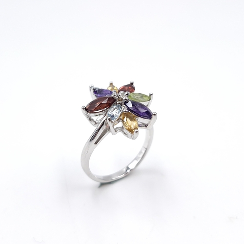 20 - A multi stone vari hue, amethyst, citrine, periodot and garnet ring set in sterling silver. Size - O... 