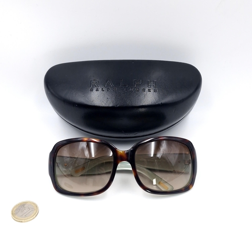 26 - A pair of Ralph Lauren sunglasses model no. RA5039. Set in faux tortoise shell frames.  Comes in ori... 