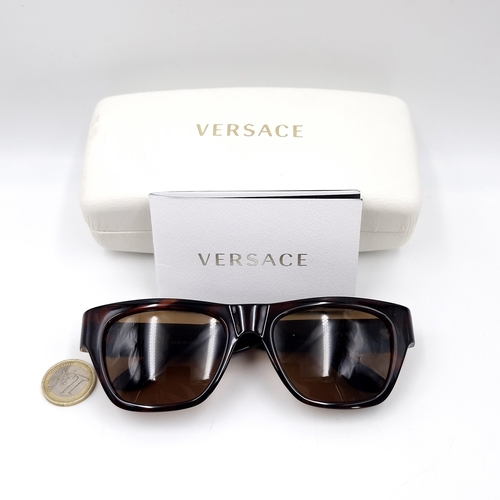 28 - A pair of Versace faux tortoise shell frame sunglasses.  Comes with certificate of authenticity & or... 