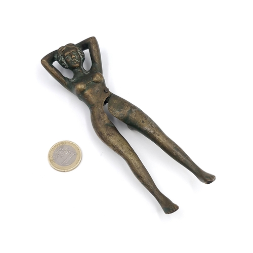 31 - An interesting antique French example of a brass nutcracker in the form of a nude female. Dimensions... 