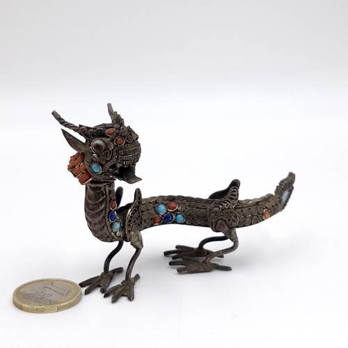 41 - An unusual example of a vintage Chinese dragon metal art figurine with articulated head and set with... 