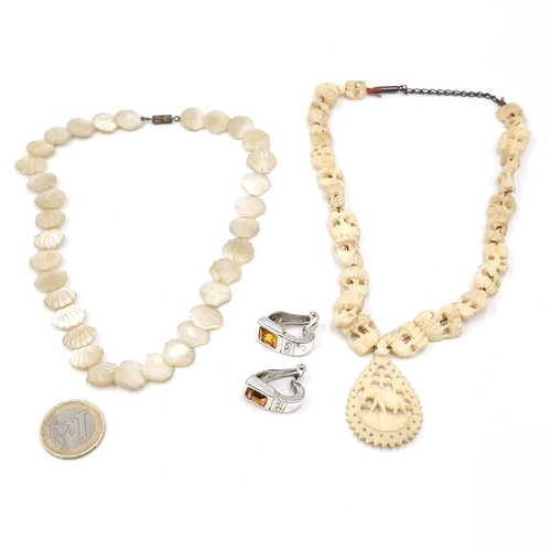 46 - Two vintage necklaces inc a mother of pearl shell necklace and an antique Bone necklace . Lengths - ... 