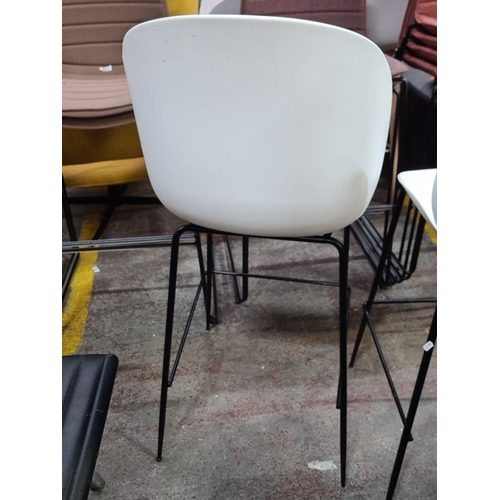 419 - Set of five modern designer moberaris white bar stools with sleek black metal frames.