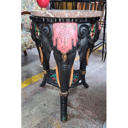 426 - Star Lot : A fabulous Hand-carved elephant pedestal table with colorful accents and marble top. Fabu... 