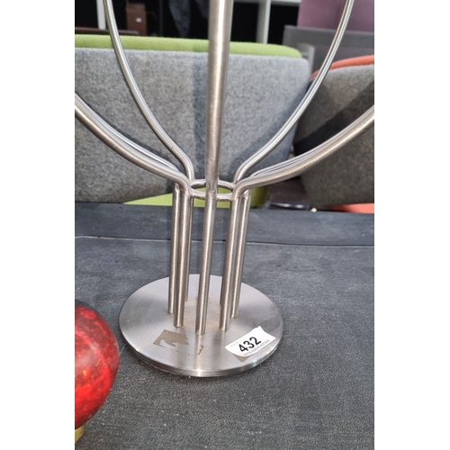 432 - Metallic candelabra with elegant design, featuring six candle holders.